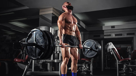 Muscular man performing a heavy deadlift