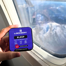 holding locked in sleep supplement in hand on airplane