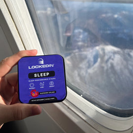 holding locked in sleep supplement in hand on airplane