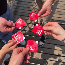 people holding a locked in energy strip in a circle
